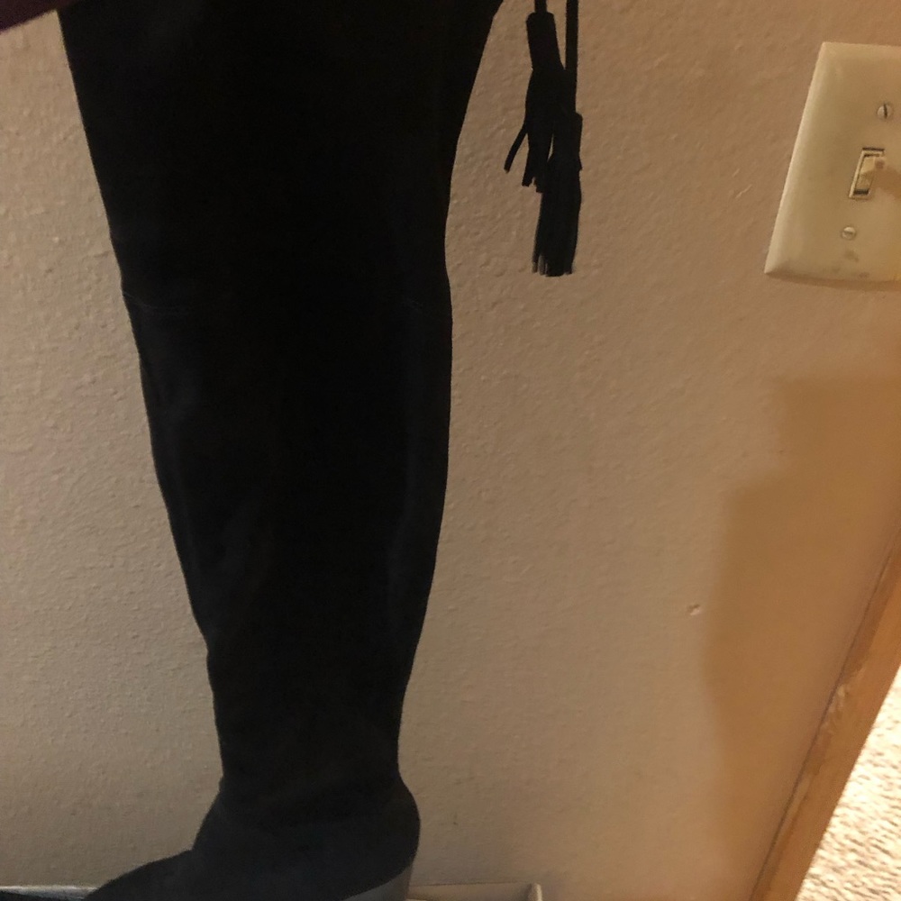 A size 6 pair of Marc Fisher thigh high boots